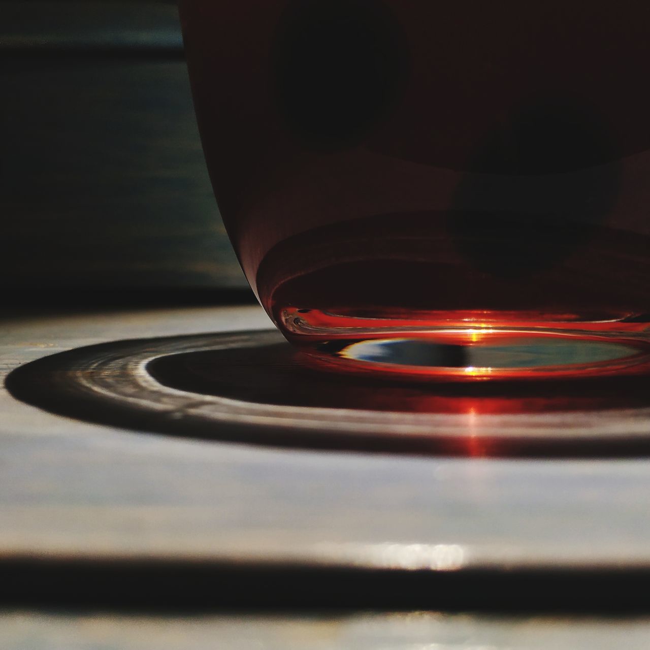 CLOSE-UP OF LIT TEA LIGHT CANDLE