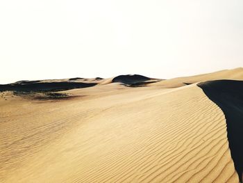 Scenic view of desert against clear sky