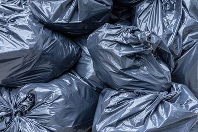 High angle view of garbage on bed