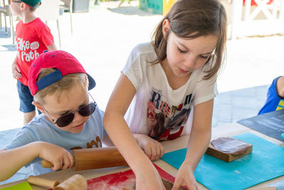 Children make homemade gingerbread cookies