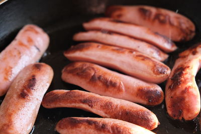 High angle view of meat on barbecue grill