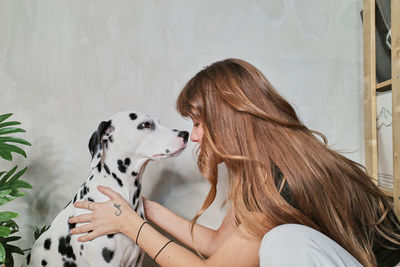 Rear view of woman with dog