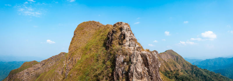 Low angle view of rock formation against sky