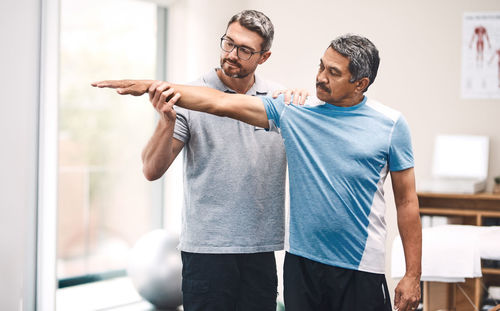 Physiotherapist working with senior patient