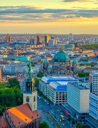 High angle view of city buildings at sunset