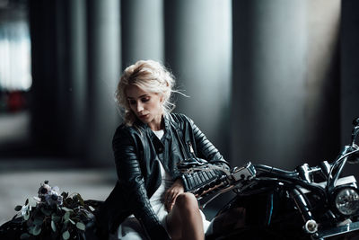 Young woman sitting outdoors