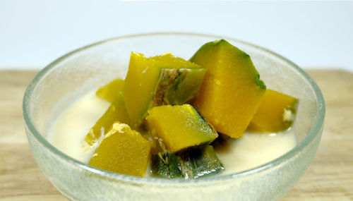 Close-up of fruits in glass bowl on table