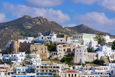 Buildings in city against sky