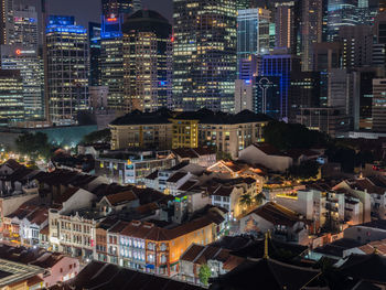 High angle view of city lit up at night