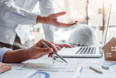 Close-up of man working on table