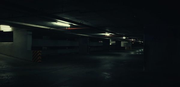 Illuminated empty parking lot in building