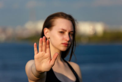 Portrait of beautiful woman against sky