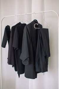 Close-up of clothes hanging on rack