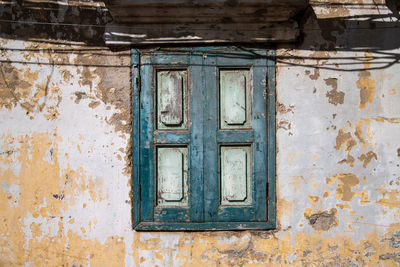 Closed door of old abandoned building