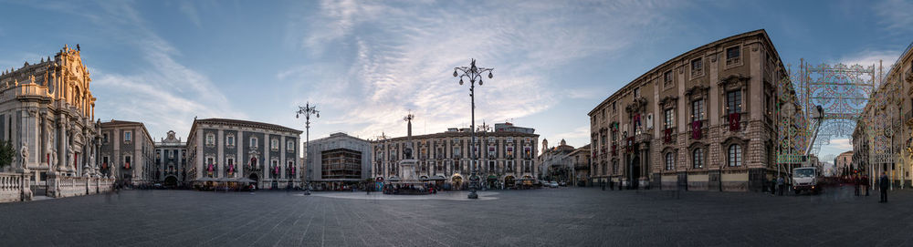 Panoramic view of buildings in city against sky