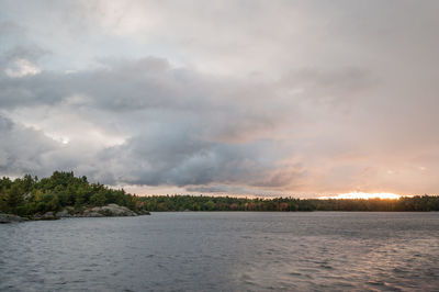 View of calm sea against cloudy sky