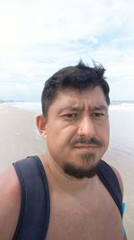 Portrait of young man on beach