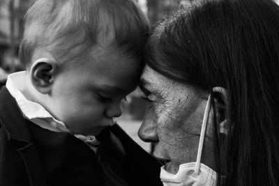 Close-up of grandma and grandchild, black and white