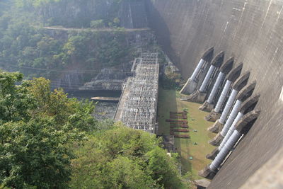 High angle view of dam amidst trees