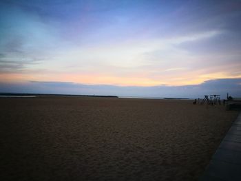 View of beach against sky during sunset