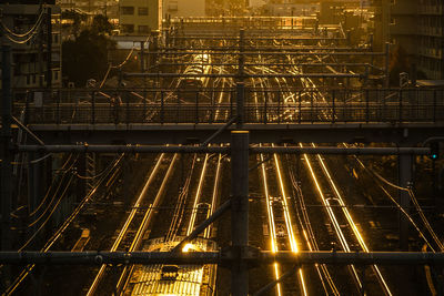 High angle view of illuminated railroad tracks at night