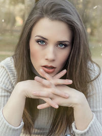 Portrait of beautiful young woman at park