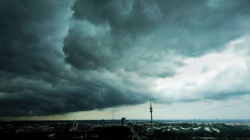 Cityscape against storm clouds