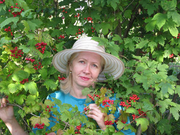 Portrait of woman amidst plants