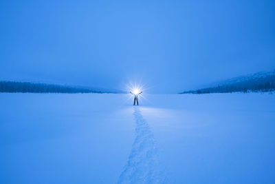 Silhouette of person in snowy landscape