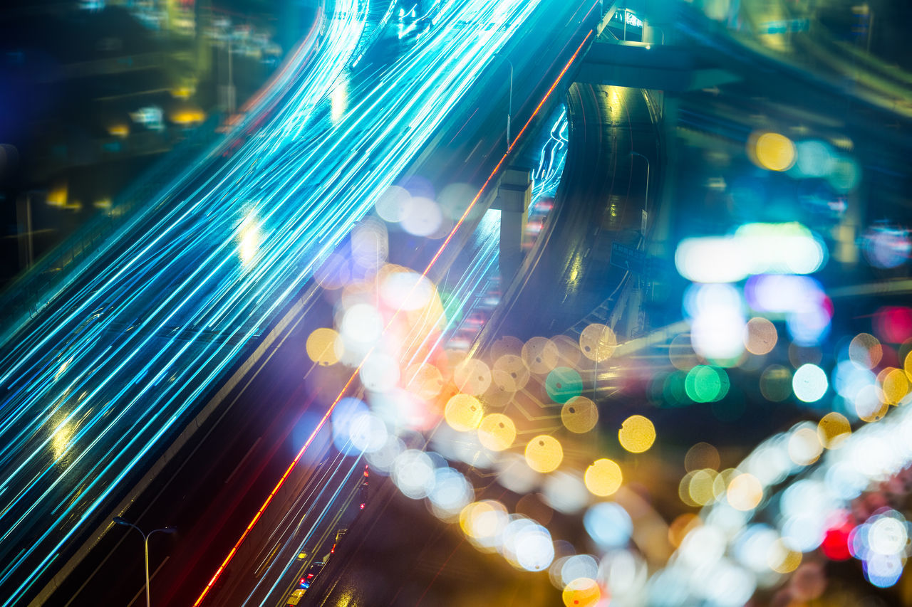 DEFOCUSED IMAGE OF ILLUMINATED CITY