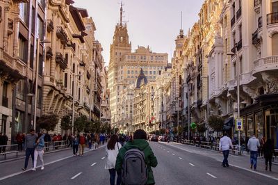 People walking on road in city