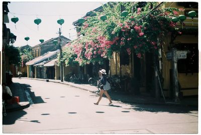 Woman standing on footbridge