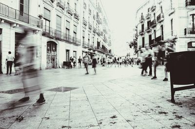 People walking on street in city