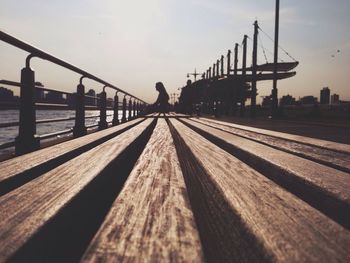 Bridge over river at sunset