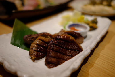 High angle view of meat in plate on table