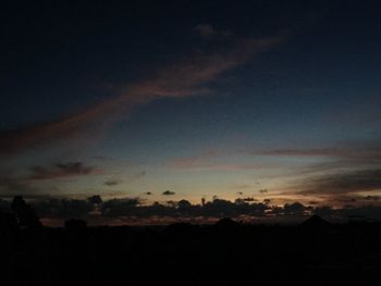 Scenic view of silhouette trees against sky at sunset