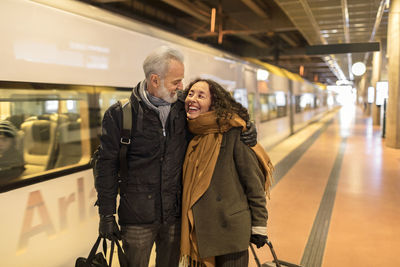 Mature couple on train station platform