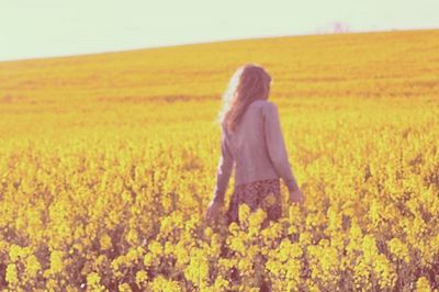 Full length of woman standing on field