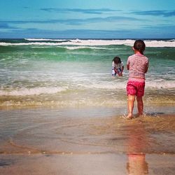 Girl standing on beach
