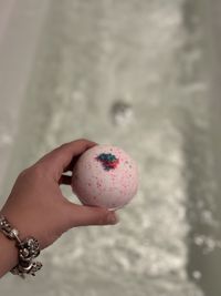 Cropped hand holding easter egg