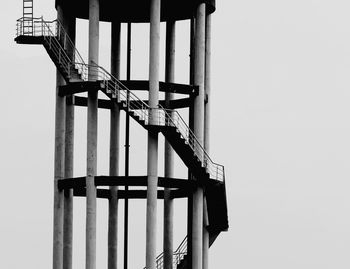 Round staircase with pillars in black and white against sky