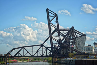 Low angle view of metal structure against sky