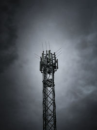 Low angle view of communications tower against sky