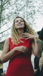 Portrait of a smiling young woman standing outdoors