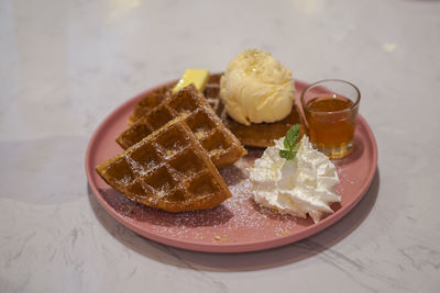 High angle view of ice cream served on table