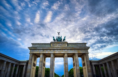 Low angle view of statue against cloudy sky