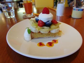 Close-up of cake served on table