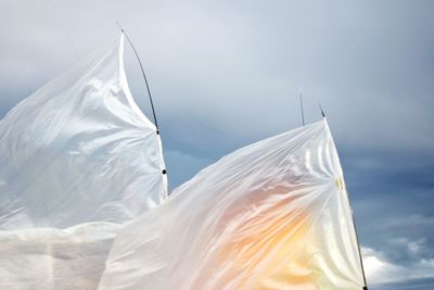 Close-up of umbrella against sky
