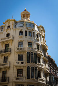 Low angle view of building against clear blue sky