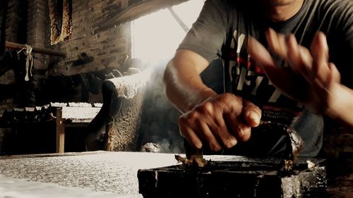 Midsection of man working at construction site